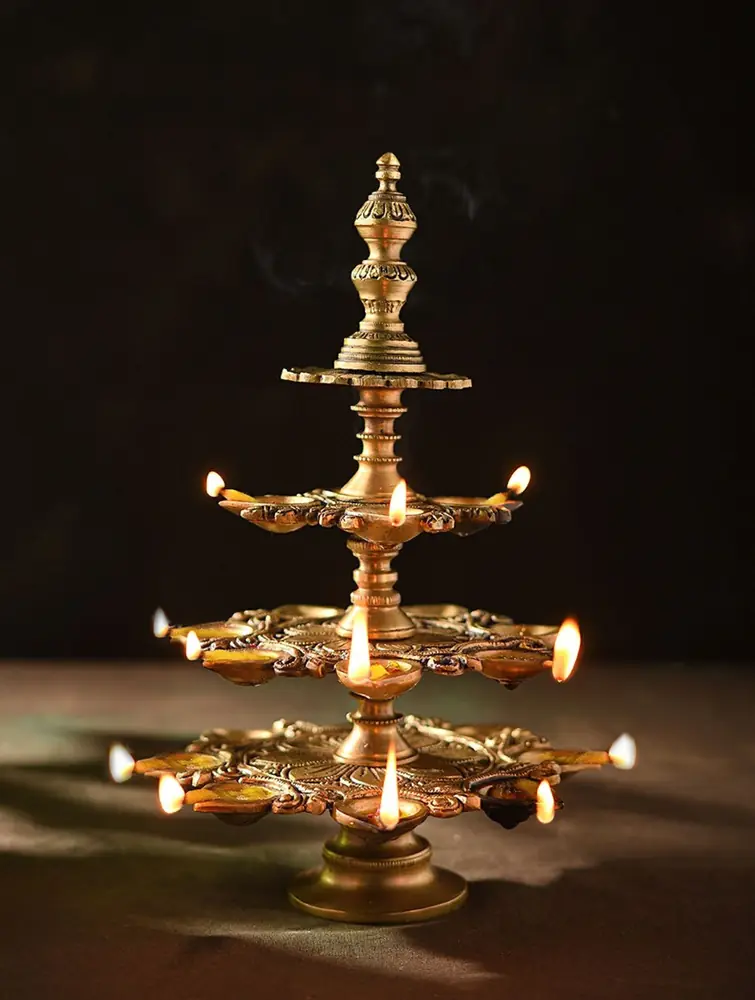 Tiered golden brass lamp with rings of small cups
