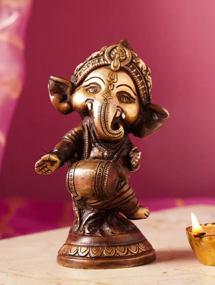 Brass Ganesha standing on a round base, front view