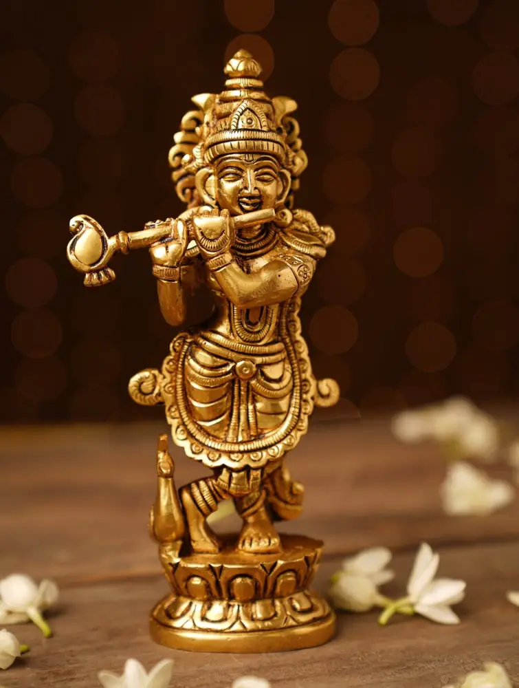 Golden brass Krishna playing the flute, front view