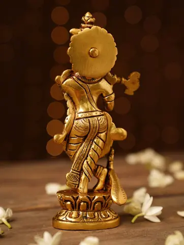 The idol seen from behind with a round disc