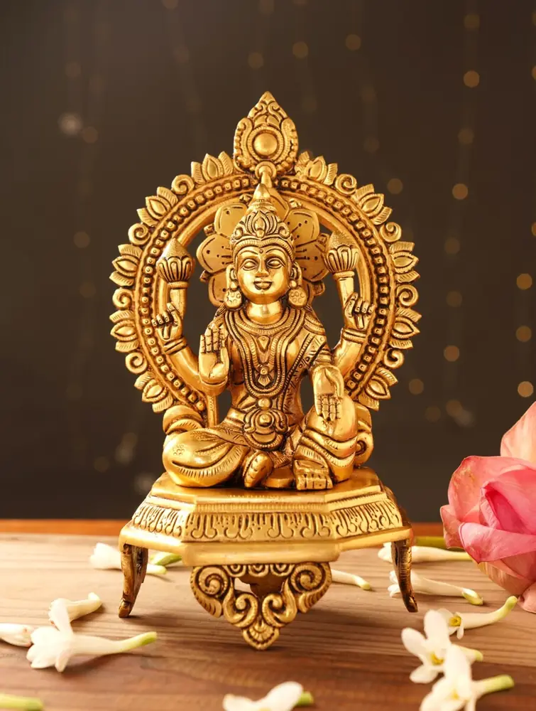 Seated brass Lakshmi with an arched halo, front view