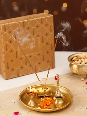 Thali set with incense, flowers and a printed gift box