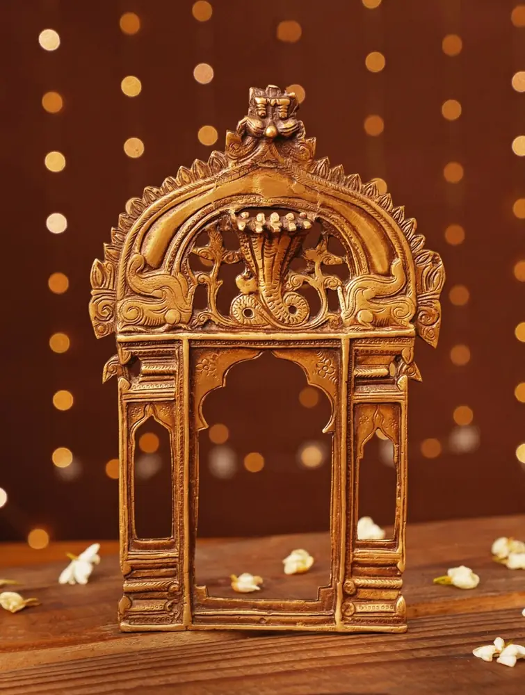 Golden brass prabhavali arch seen from the front