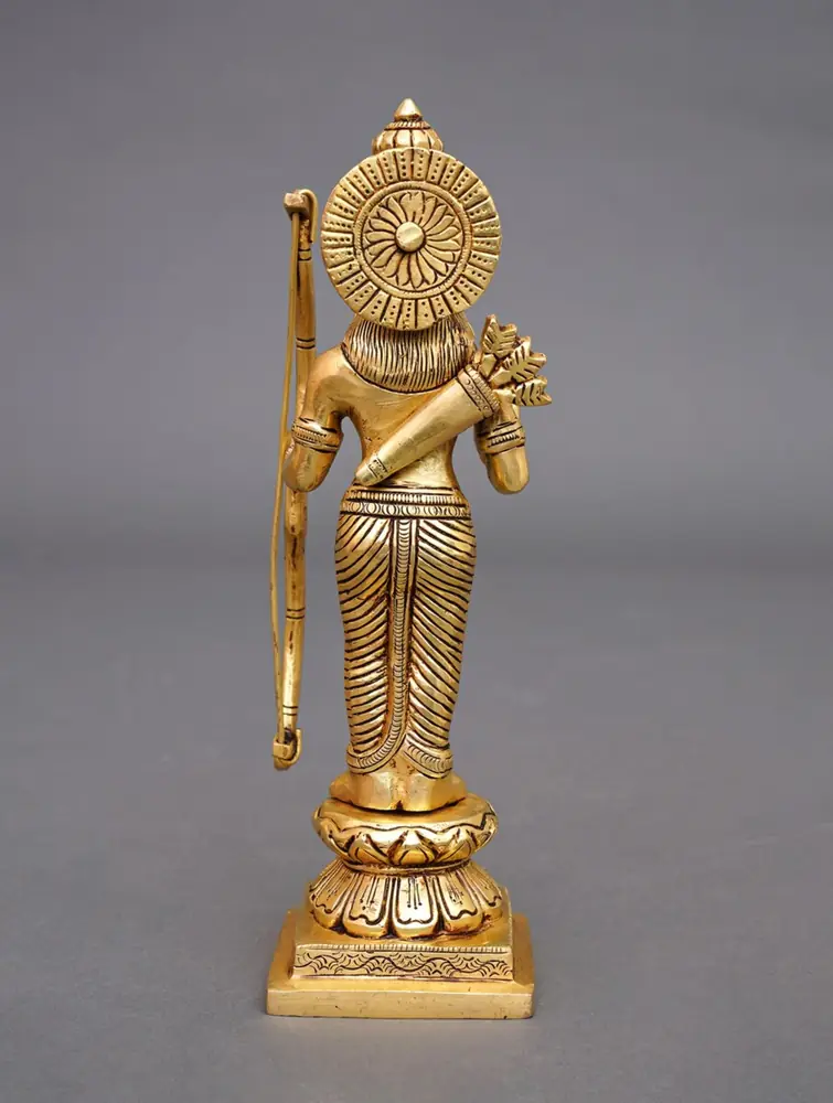 Golden brass Rama holding a bow, front view on grey