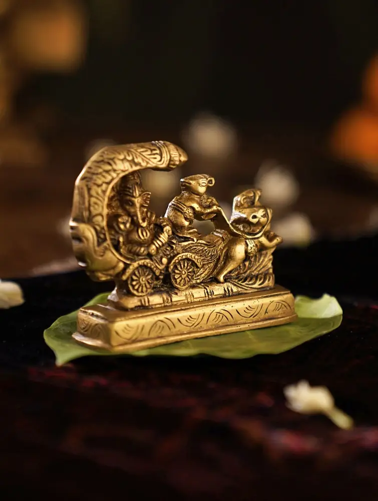 Golden brass tabletop piece with a figure in a chariot