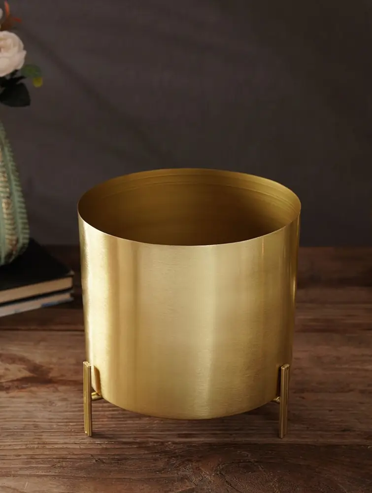 The planter on its stand without a plant