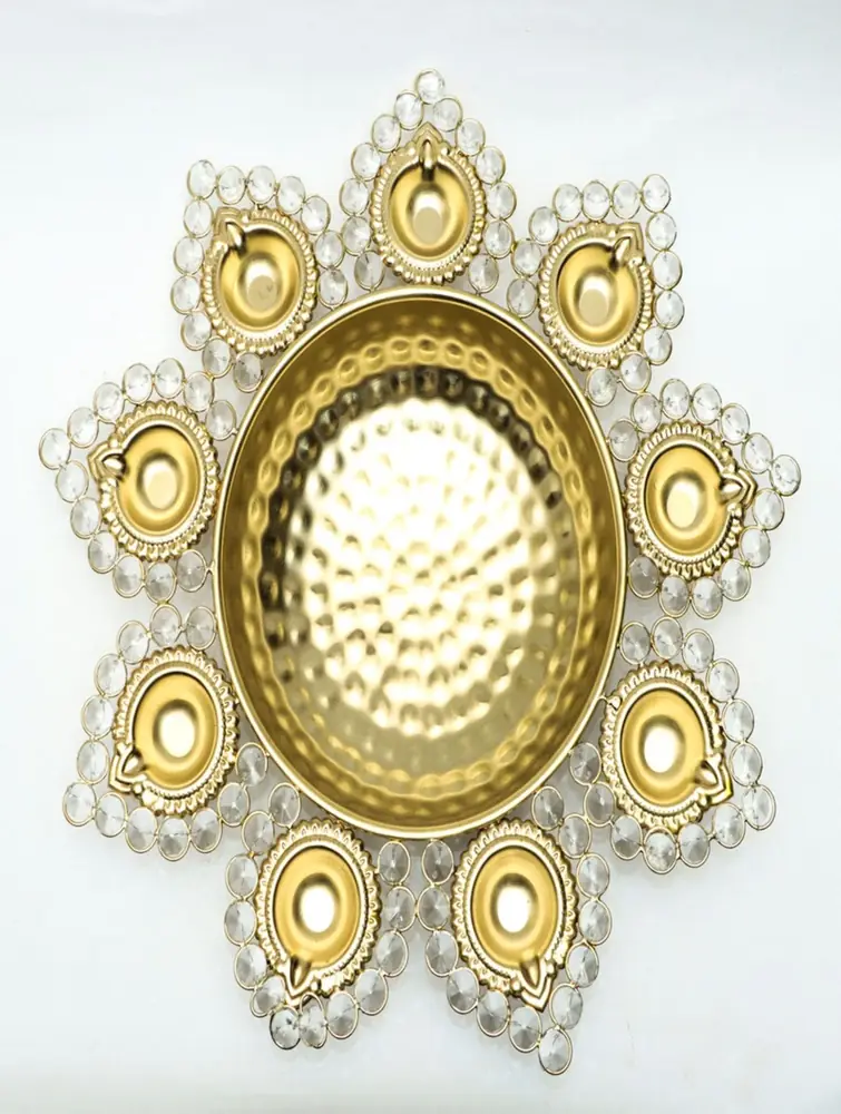 Golden urli with hammered centre bowl and bead-edged cups on white