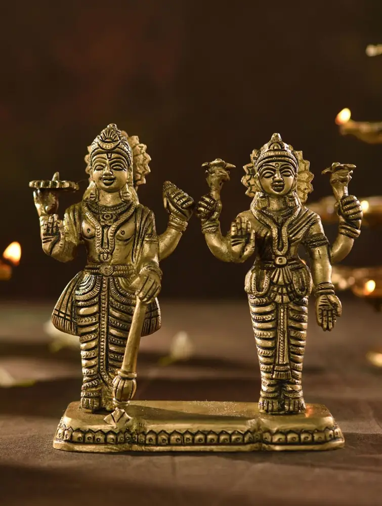 Two standing brass figures on a shared base