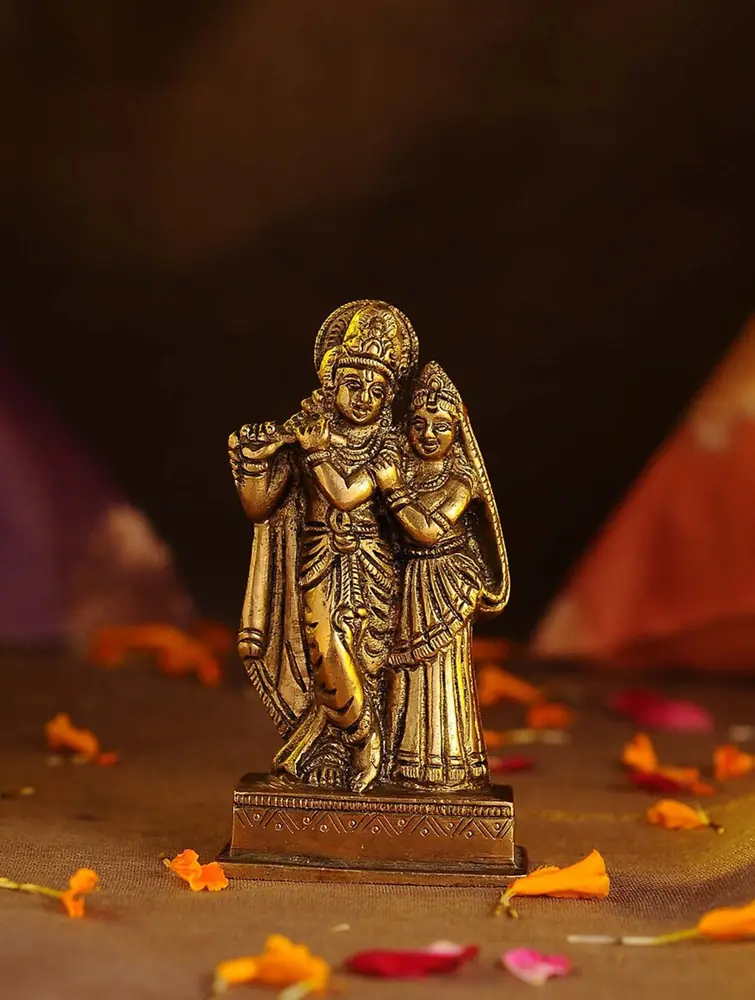 Krishna with a flute and Radha on a brass base