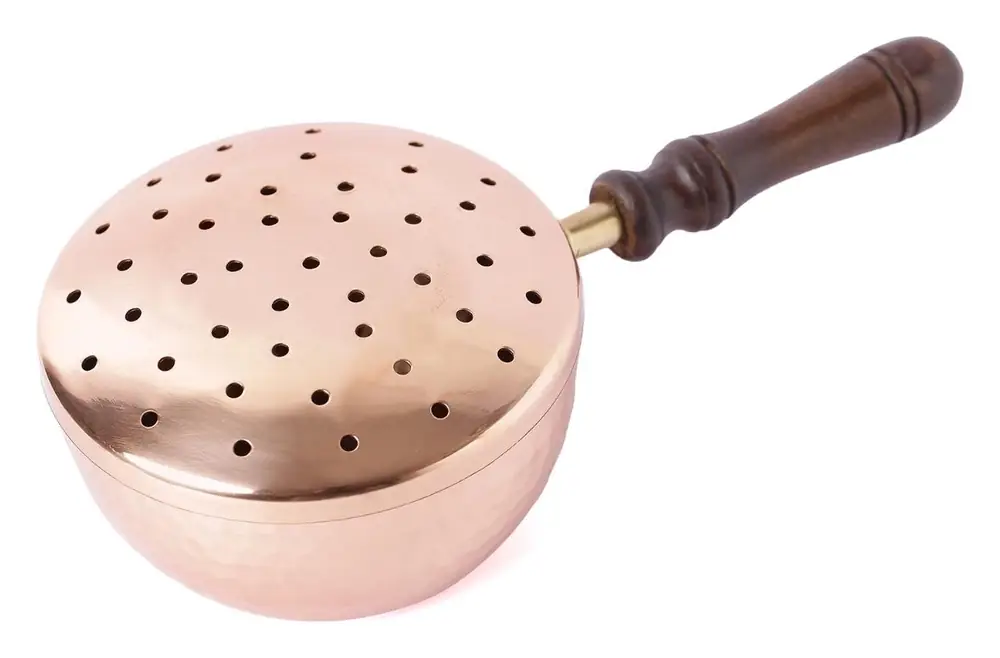 Hammered copper fumer with a perforated lid and a wooden handle