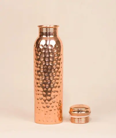 The bottle standing with its cap set in front