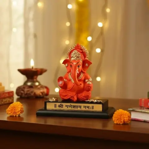 The idol on a table with warm lights behind