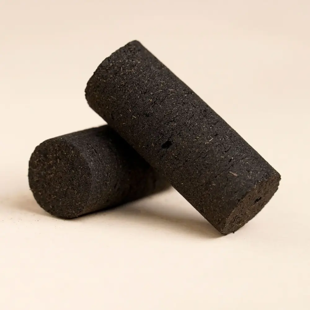 Two black dhoop cylinders