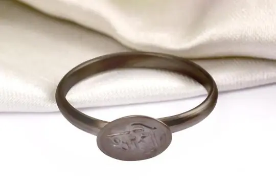 Black iron horseshoe ring seen from the front