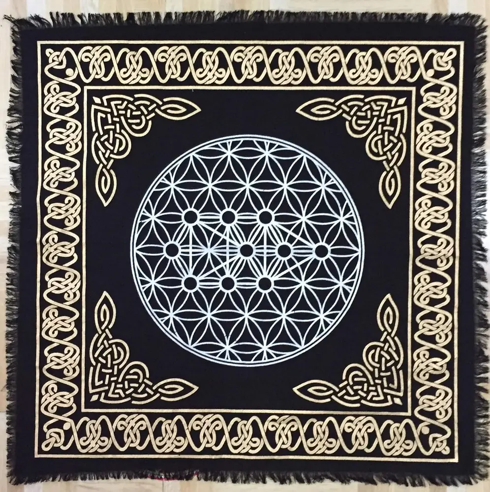 Top view of the black altar cloth with gold border and silver pattern