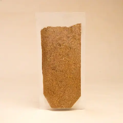Back of the pouch with a clear window showing the powder