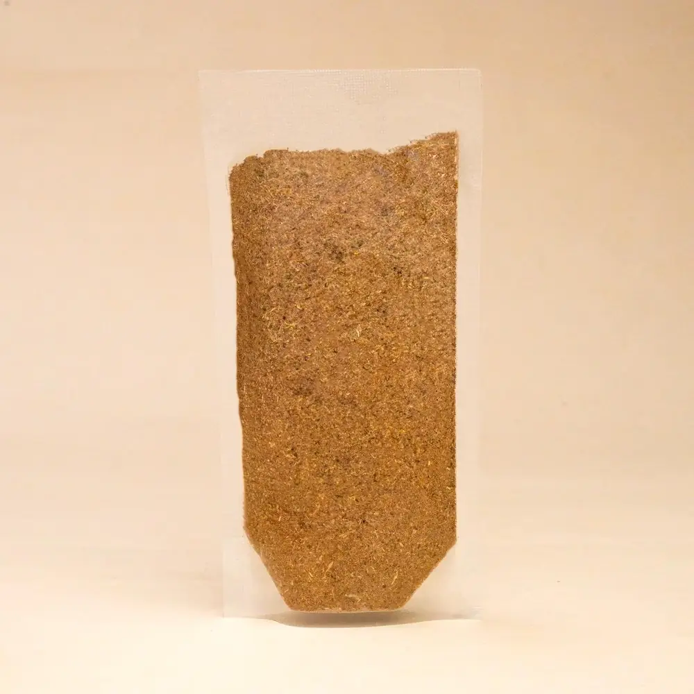 Back of the pouch with a clear window showing the powder