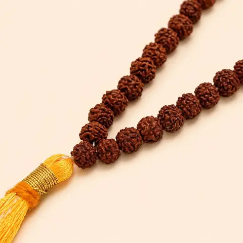 The tassel end of the mala and beads