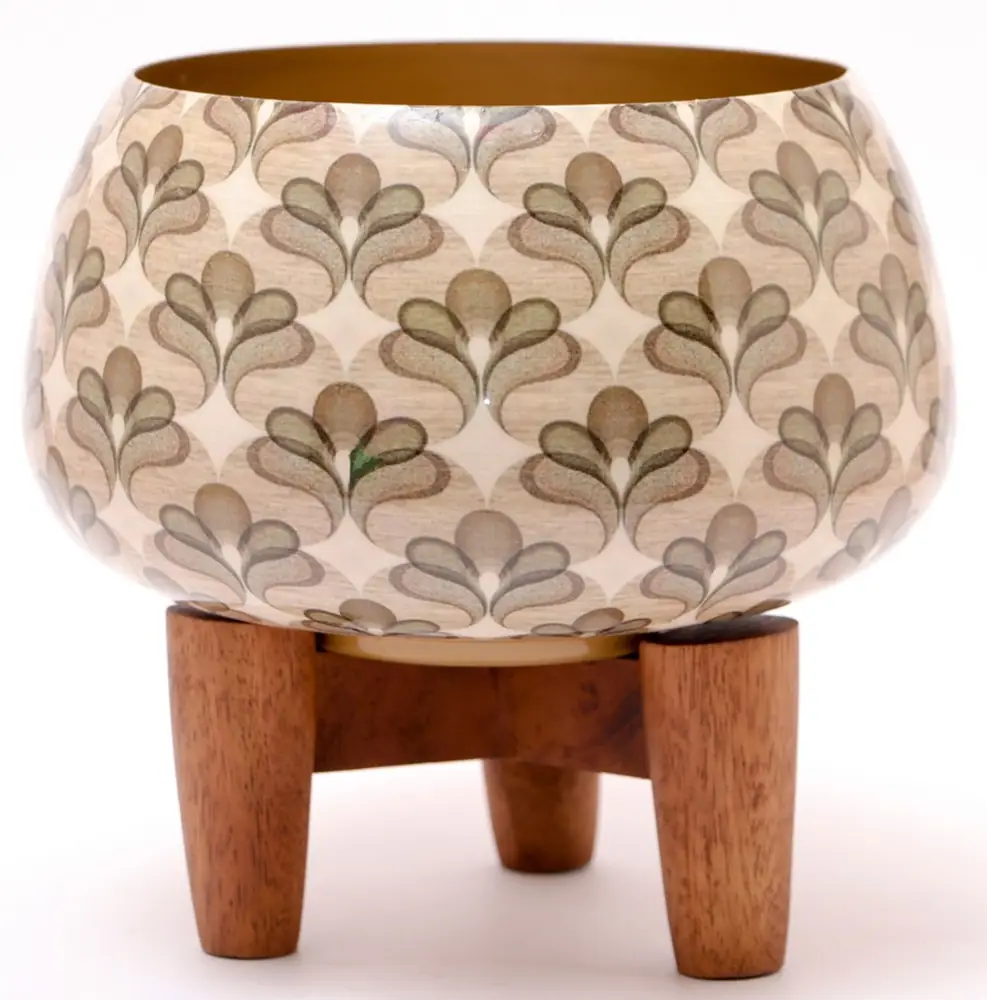 Ivory iron planter with leaf pattern on a wooden stand