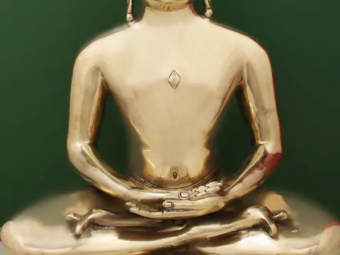 Close view of the hands in the lap