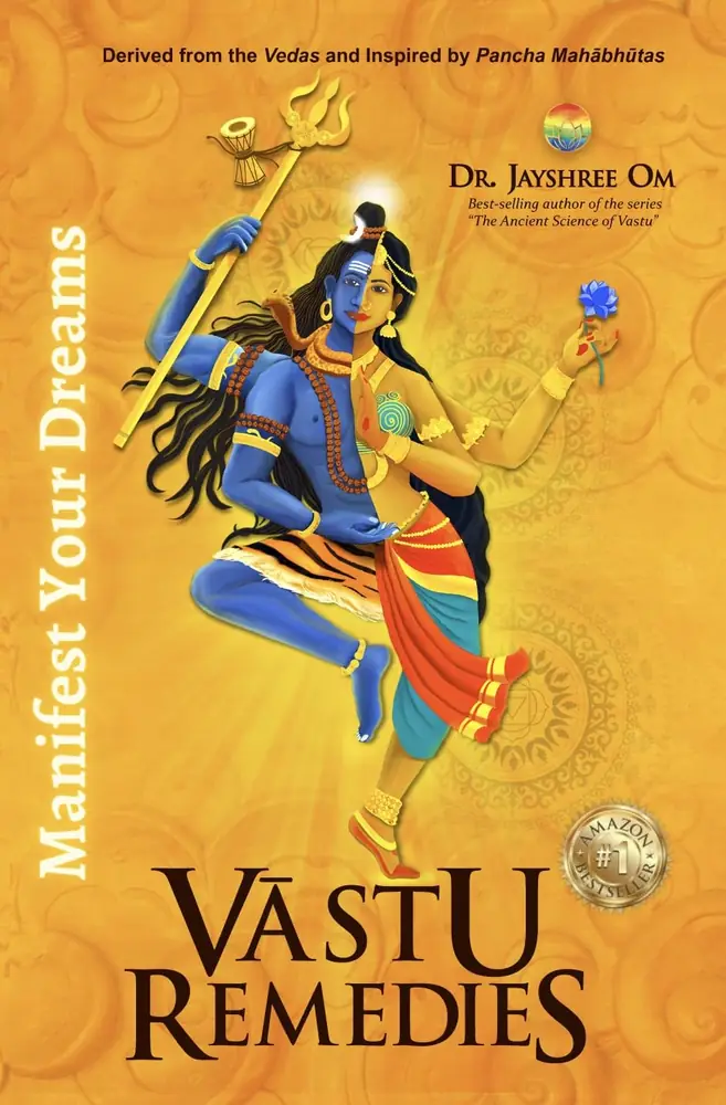 Orange front cover of Vastu Remedies with a deity painted in blue