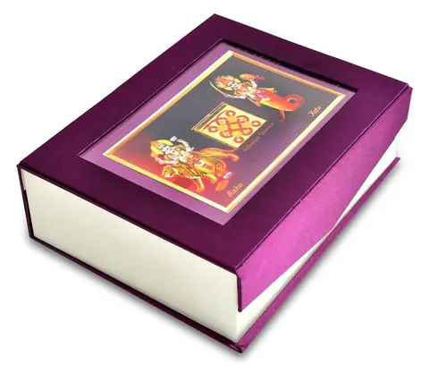 The closed purple gift box with a framed picture on the lid