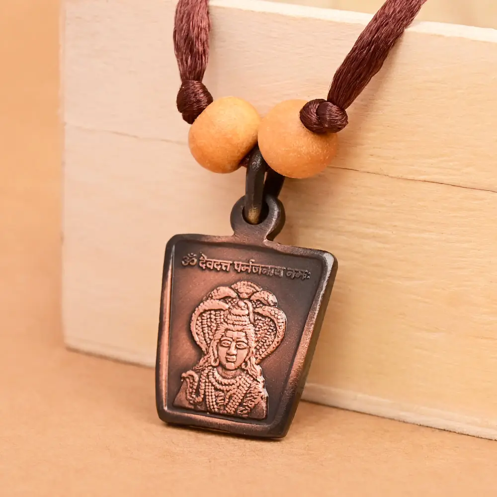 The deity side on a brown cord with two beads