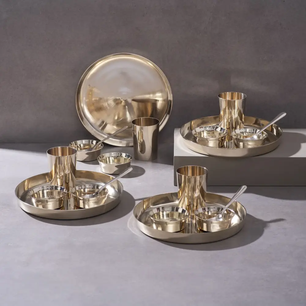 The full kansa set of four place settings on a grey ground