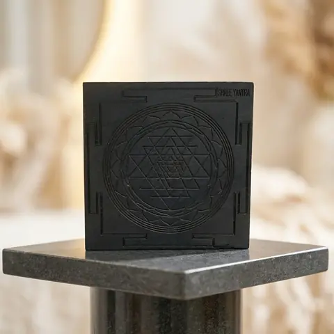 The carved block on a stone plinth