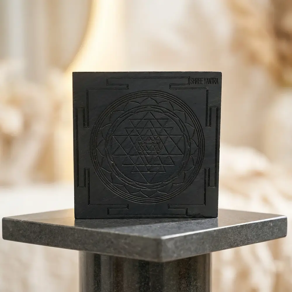 The carved block on a stone plinth