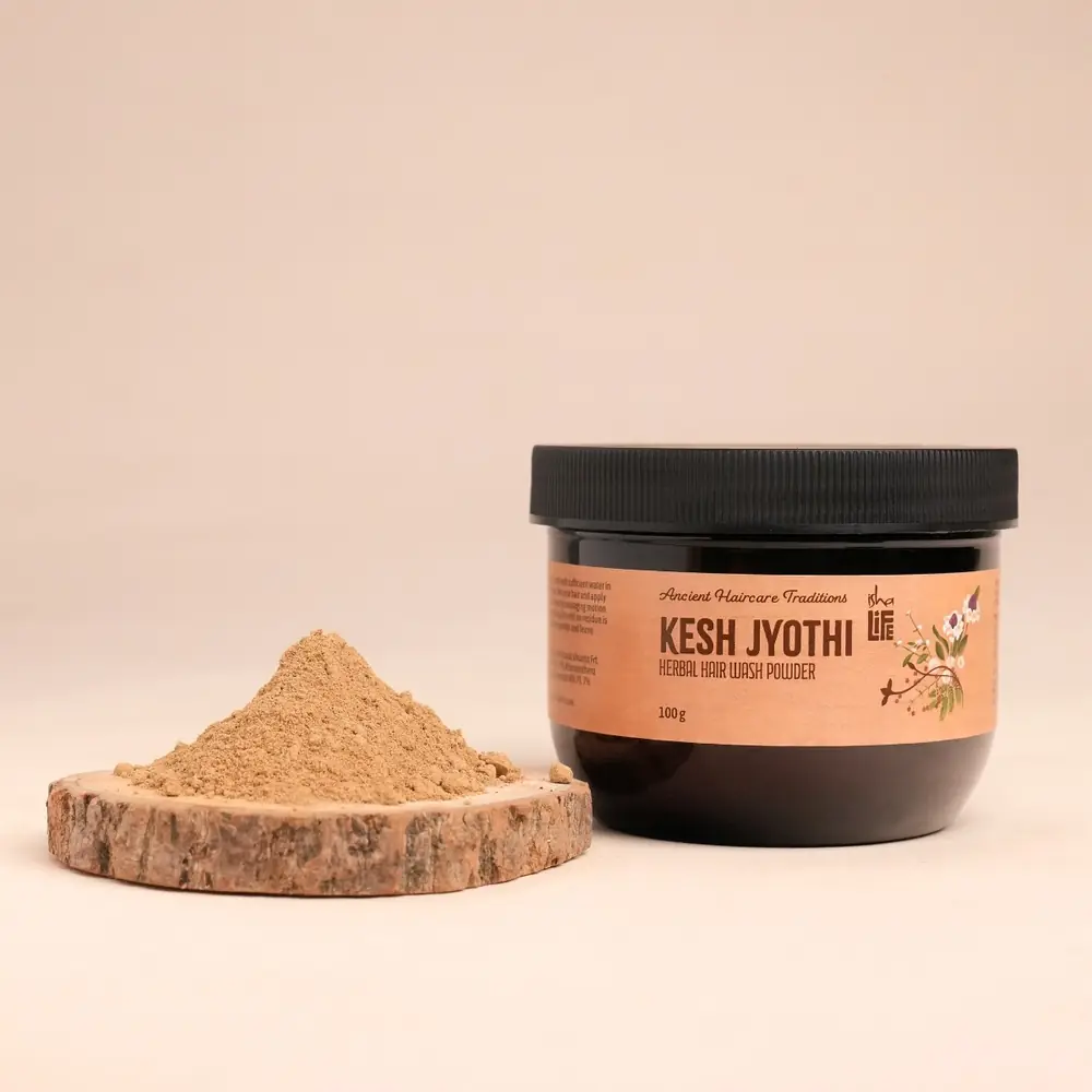 Powder heaped on a wooden slice beside the jar