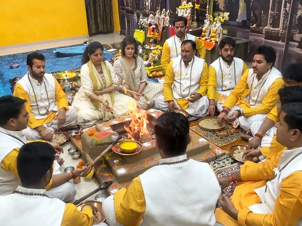 Priests seated around the havan fire