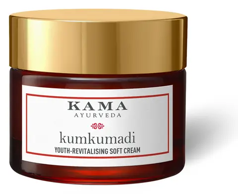Red jar of cream with a gold lid