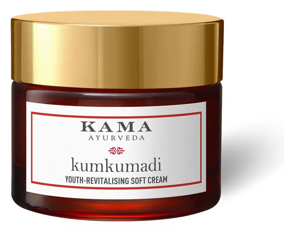 Red jar of cream with a gold lid