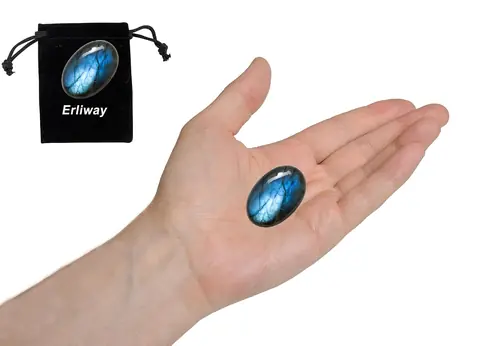 A small labradorite stone held in the palm for scale