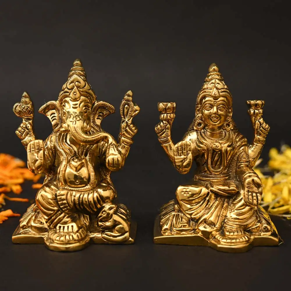 Lakshmi and Ganesha brass idols side by side