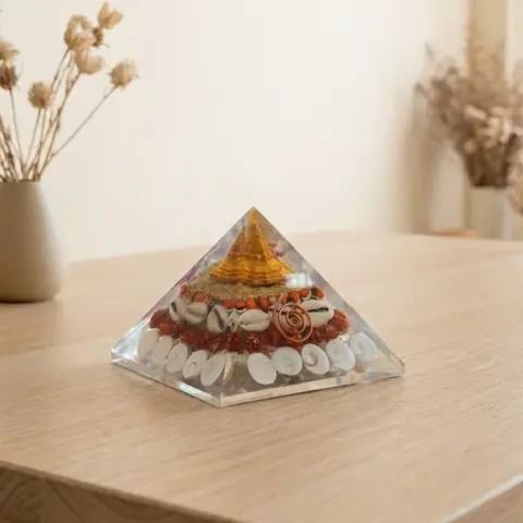 The pyramid on a light table with dried grass behind