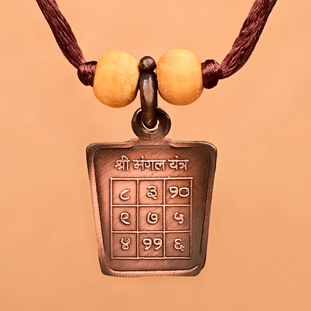 Mangal yantra side of the copper locket on a thread