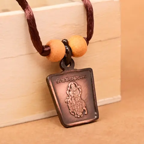 The deity side on a brown cord with two beads