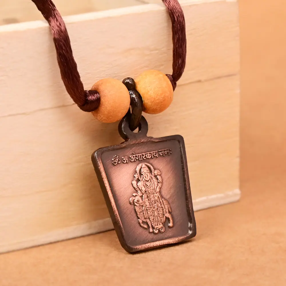 The deity side on a brown cord with two beads