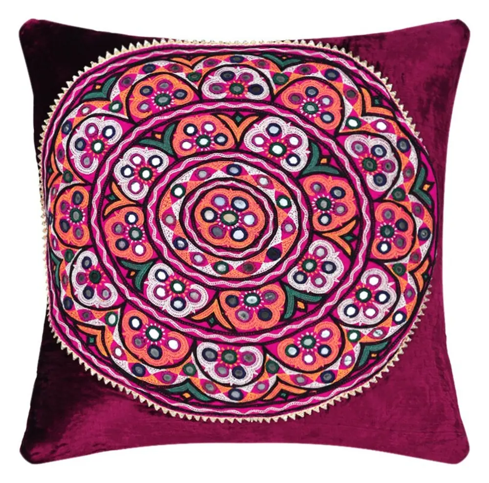 Maroon velvet cover with a round embroidered medallion