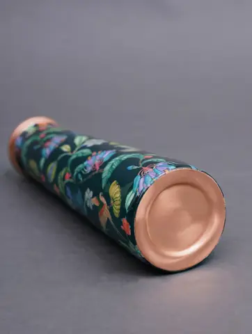 Bottle lying on its side with copper base visible