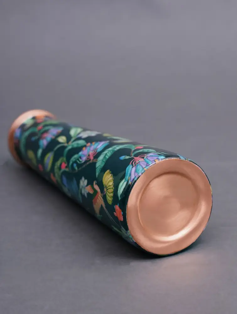 Bottle lying on its side with copper base visible