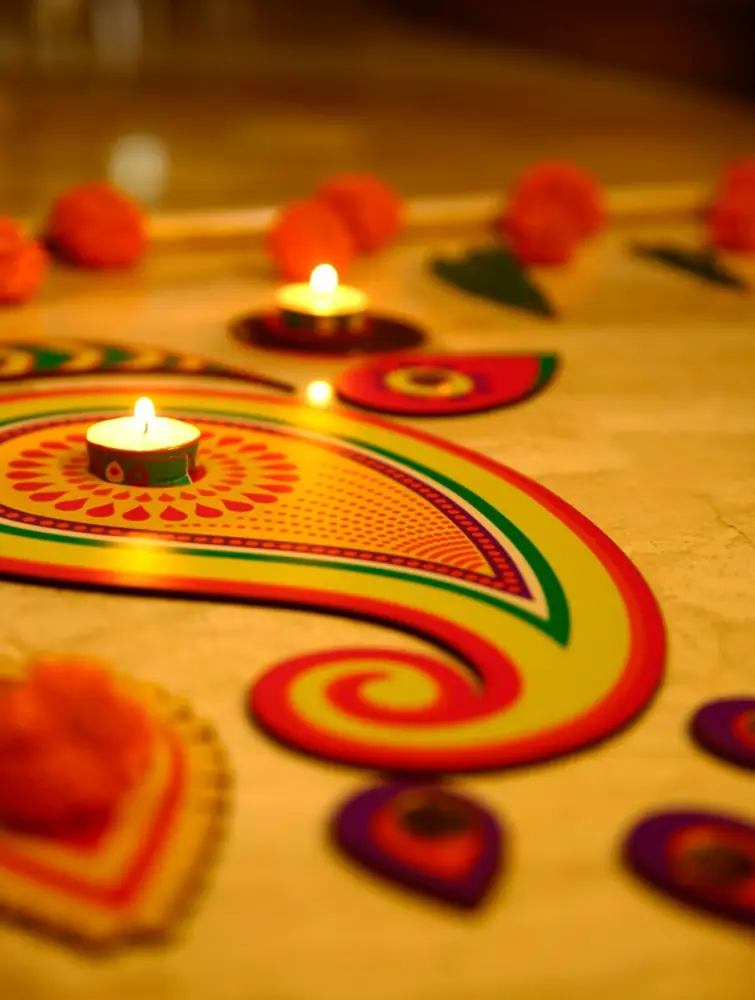 Rangoli pieces placed in a row at a doorway