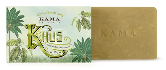 Khus soap bar beside its green illustrated wrapper