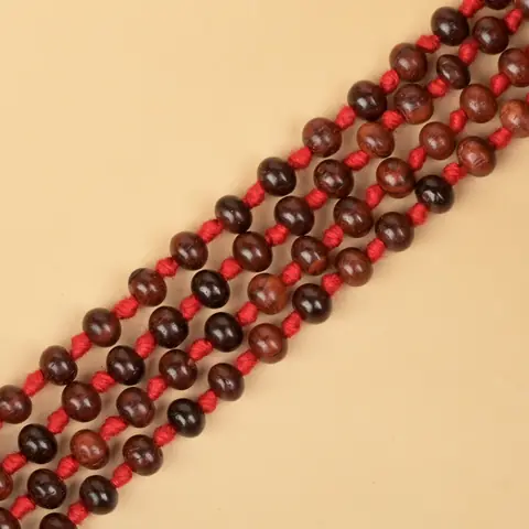 Close view of the dark red beads