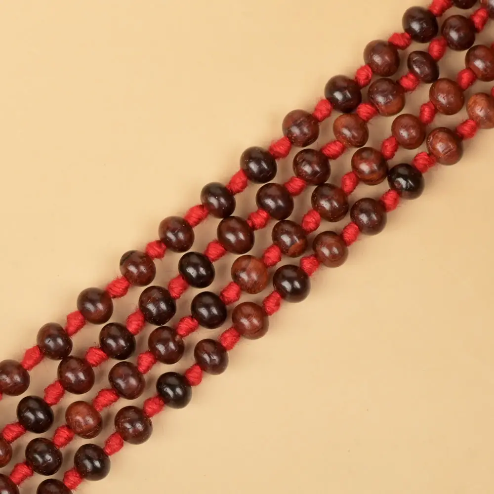 Close view of the dark red beads