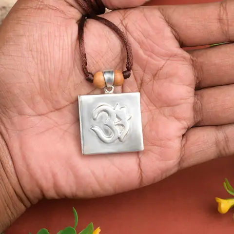 Pendant held on a palm to show its size