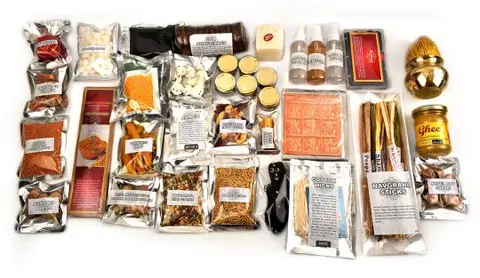 Packed puja and havan items on a white ground