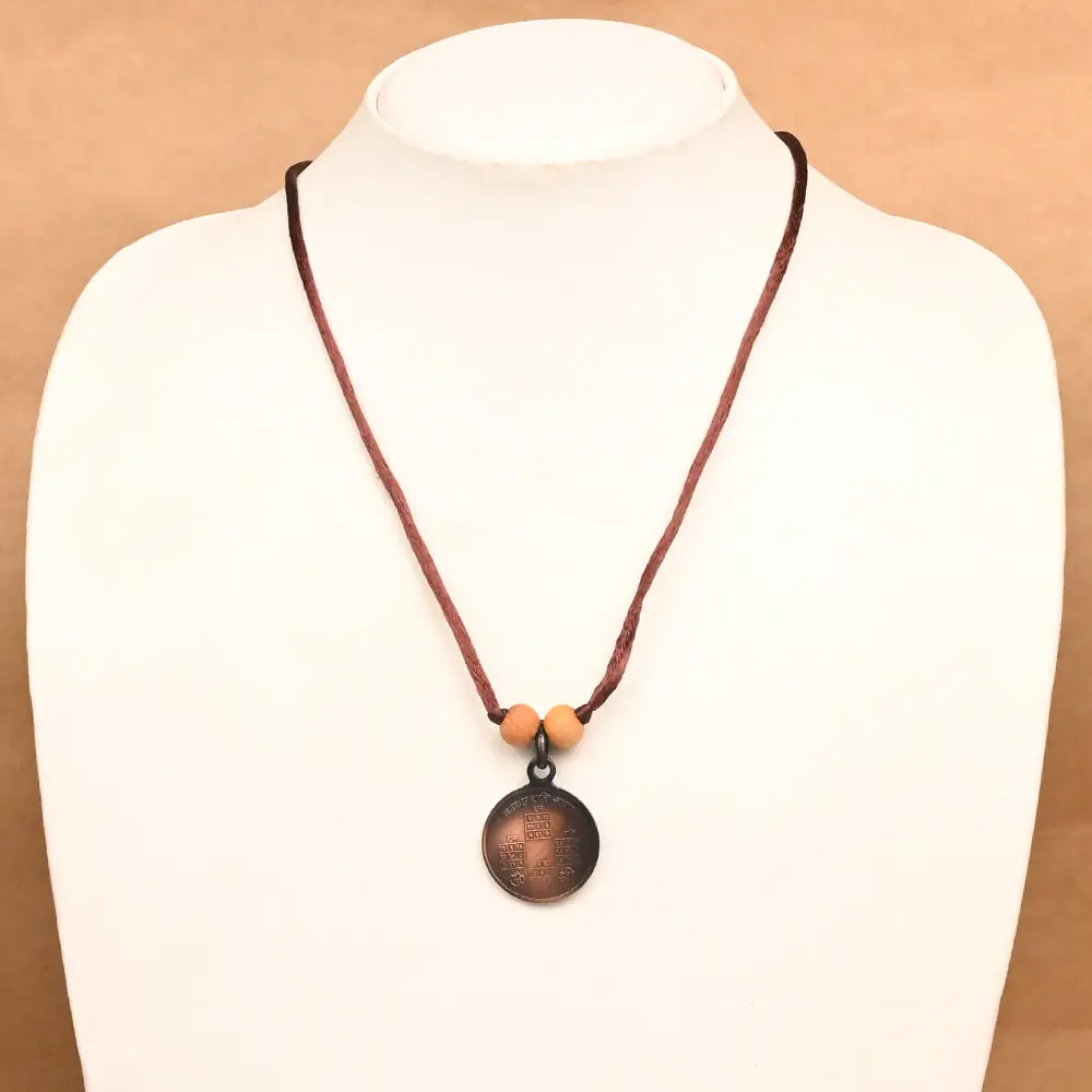 The locket on a jewellery bust, showing how small it is